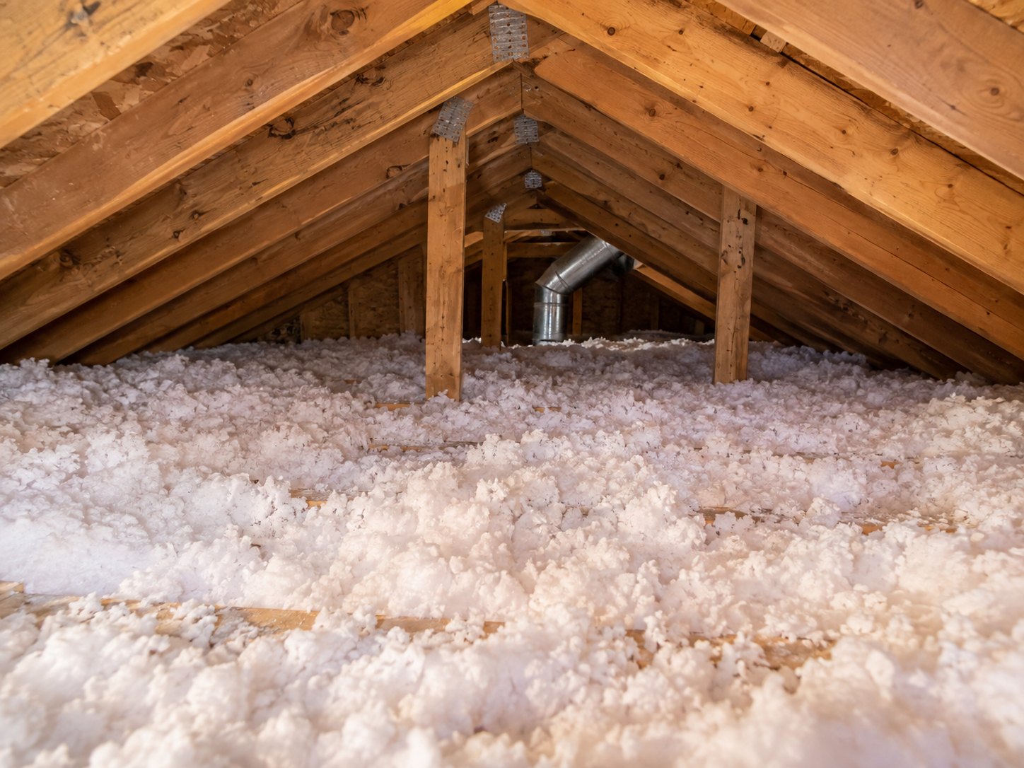 Attic insulation topped up across the attic floor